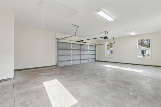 177 Verano St, Kingsland, GA 31548 - garage featuring a garage door opener and baseboards