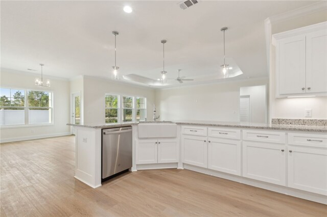 177 Verano St, Kingsland, GA 31548 - kitchen featuring dishwasher, light wood-style floors, a tray ceiling, white cabinetry, and light stone countertops