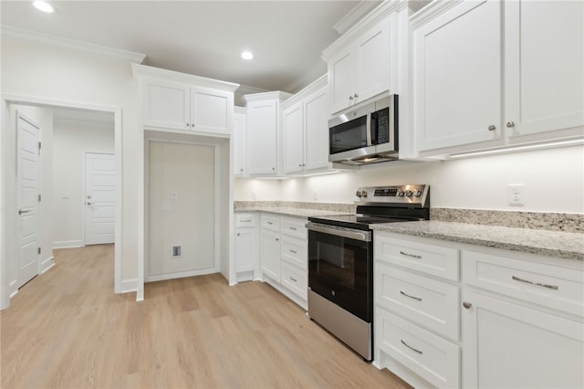 177 Verano St, Kingsland, GA 31548 - kitchen featuring stainless steel appliances, white cabinetry, light wood-type flooring, recessed lighting, and light stone countertops