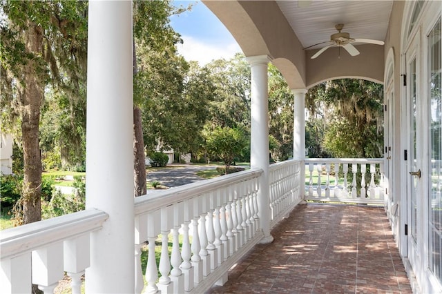 exterior space featuring covered porch and ceiling fan