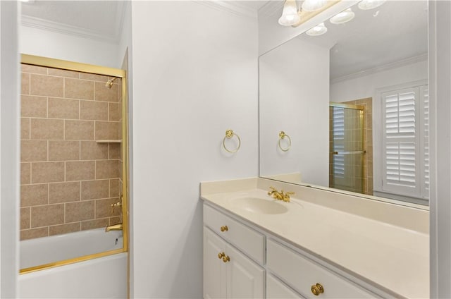 bathroom with shower / bath combination with glass door, vanity, and crown molding