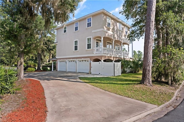 view of front of property with a front yard and a garage