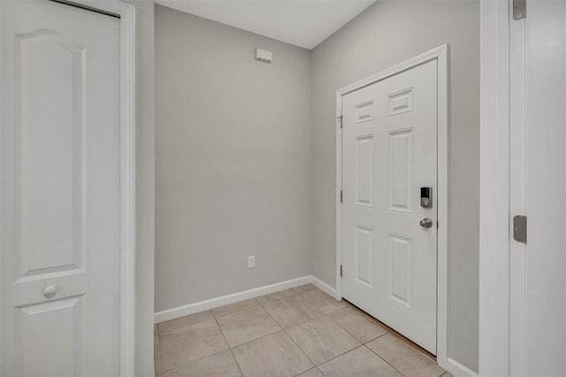 entryway featuring light tile patterned floors