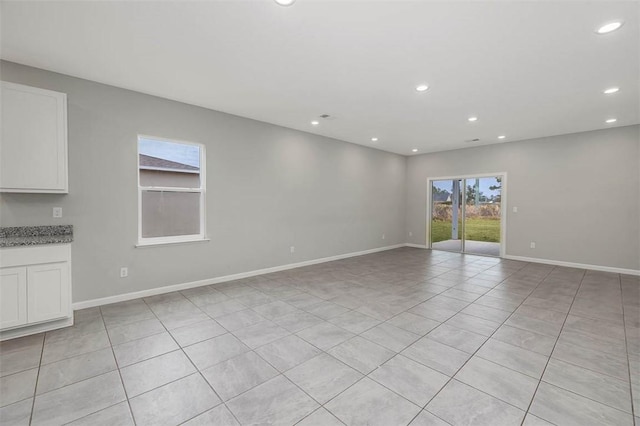 empty room featuring light tile patterned floors