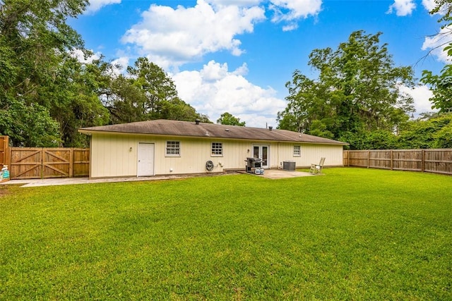 1201 Fairway Rd, Brunswick, GA 31525 - back of house featuring a patio area, cooling unit, and a gate