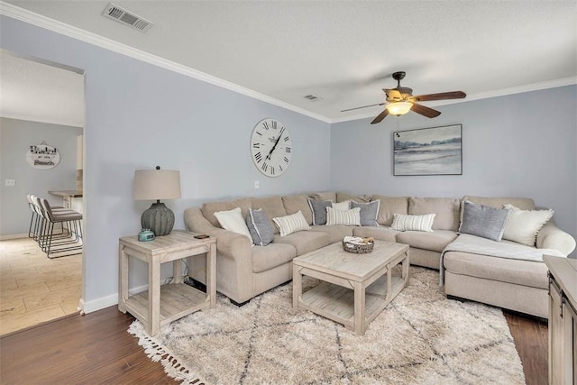 1201 Fairway Rd, Brunswick, GA 31525 - living room featuring crown molding, ceiling fan, wood finished floors, and baseboards