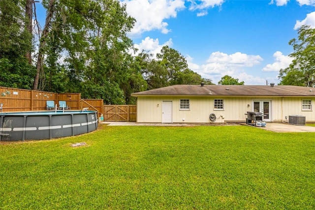 1201 Fairway Rd, Brunswick, GA 31525 - rear view of property featuring cooling unit, french doors, and a patio area