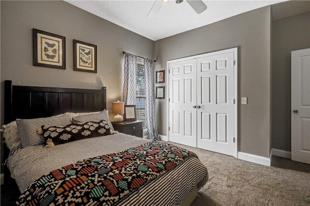 carpeted bedroom with a closet, a ceiling fan, and baseboards