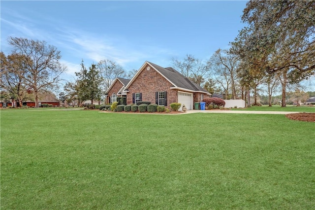 view of side of property featuring brick siding, a garage, a lawn, and driveway