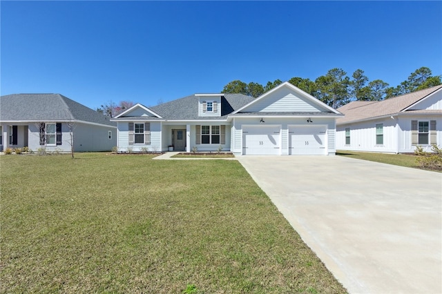 view of front facade featuring a front yard, driveway, and an attached garage