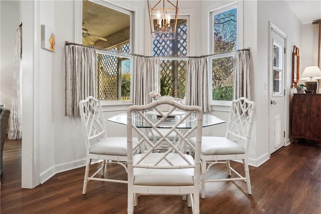 dining room featuring an inviting chandelier and dark hardwood / wood-style flooring