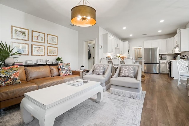 living room featuring dark hardwood / wood-style flooring