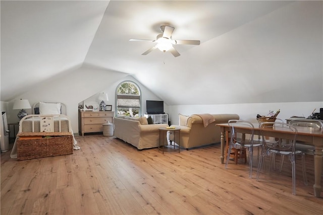 interior space featuring ceiling fan, lofted ceiling, and light wood-type flooring