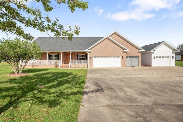 ranch-style home featuring a front lawn, a porch, and a garage