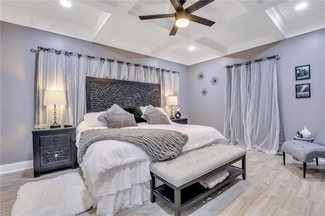 bedroom with beamed ceiling, hardwood / wood-style floors, ceiling fan, and coffered ceiling