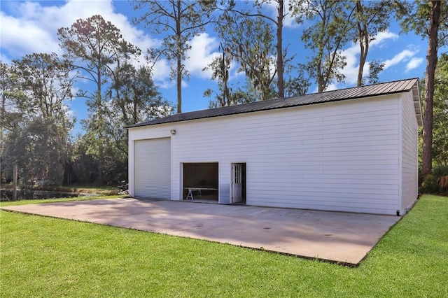 garage with a yard