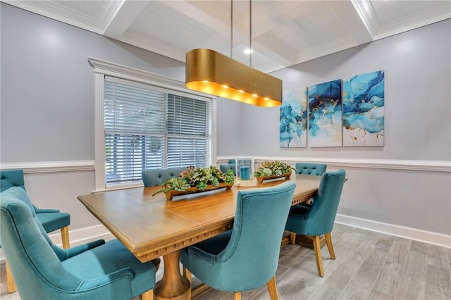 dining area with coffered ceiling, beam ceiling, crown molding, and light hardwood / wood-style flooring