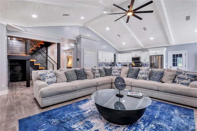 living room with light wood-type flooring, ceiling fan, high vaulted ceiling, wooden ceiling, and beamed ceiling