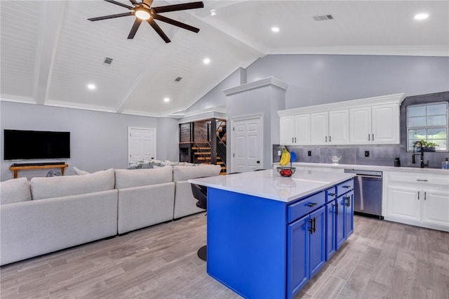 kitchen featuring white cabinets, dishwasher, light wood-type flooring, and blue cabinets