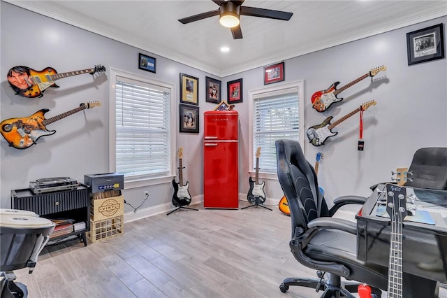 office area featuring light hardwood / wood-style floors, ceiling fan, and ornamental molding