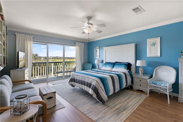 bedroom with access to exterior, ceiling fan, light hardwood / wood-style flooring, and ornamental molding