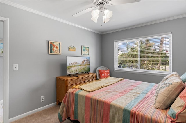 carpeted bedroom featuring ceiling fan and ornamental molding