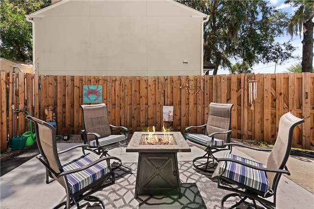 view of patio featuring an outdoor fire pit