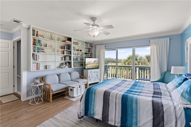 bedroom featuring ceiling fan, wood-type flooring, crown molding, and access to outside