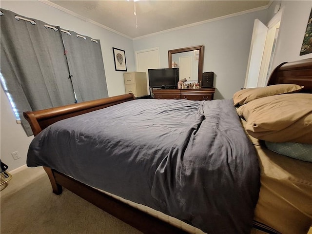 carpeted bedroom featuring crown molding