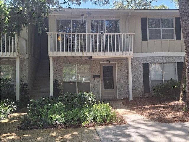 multi unit property featuring a balcony