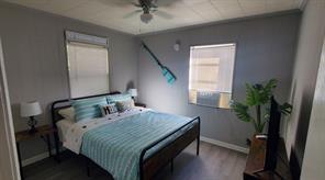 bedroom featuring ceiling fan and wood-type flooring