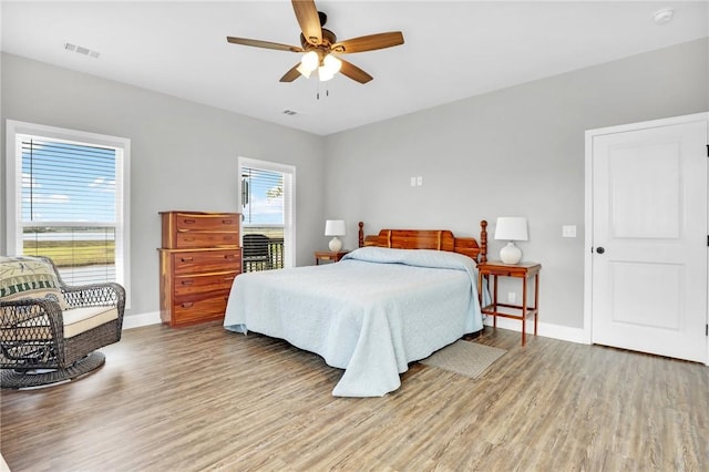 bedroom featuring hardwood / wood-style floors and ceiling fan