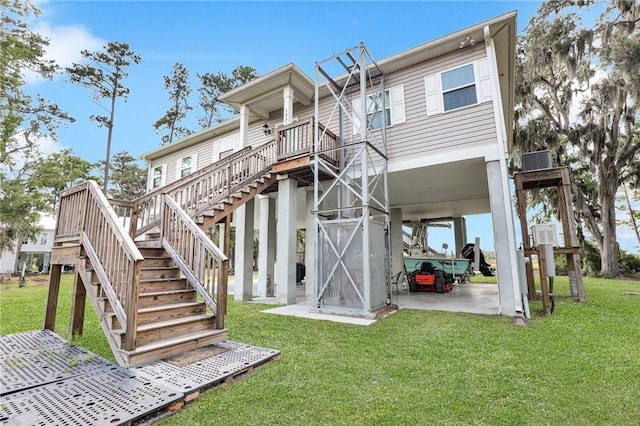 back of property featuring a yard and a patio