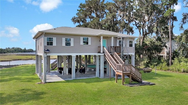 exterior space featuring a yard and a water view