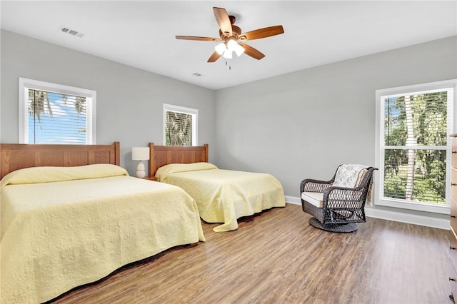 bedroom featuring ceiling fan and wood-type flooring