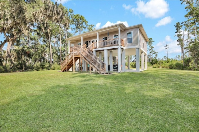 back of property featuring a porch and a yard