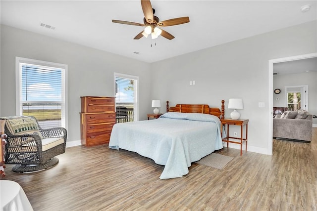 bedroom featuring wood-type flooring and ceiling fan