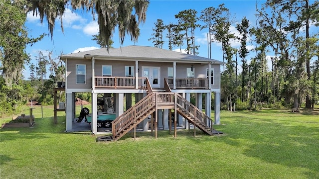 rear view of house with a yard