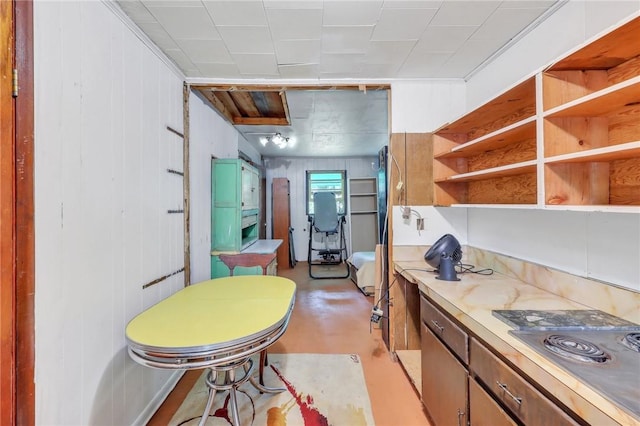 kitchen with ornamental molding and stainless steel gas cooktop