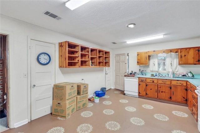 kitchen featuring dishwasher, a textured ceiling, and sink