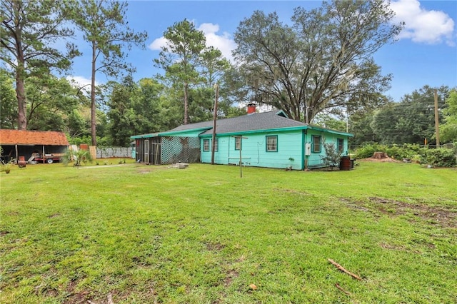 back of house featuring a yard