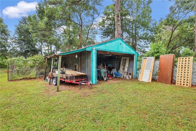 view of outbuilding featuring a yard