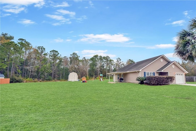 view of yard with a shed and a garage