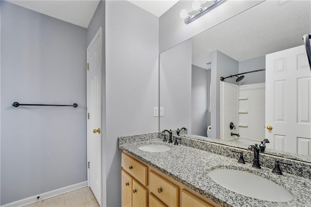 full bathroom with toilet, a textured ceiling, shower / tub combination, tile patterned floors, and vanity