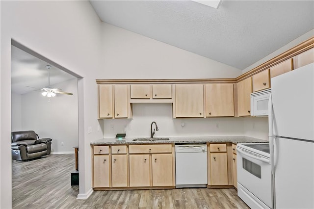 kitchen featuring sink, light wood-type flooring, white appliances, and light brown cabinetry