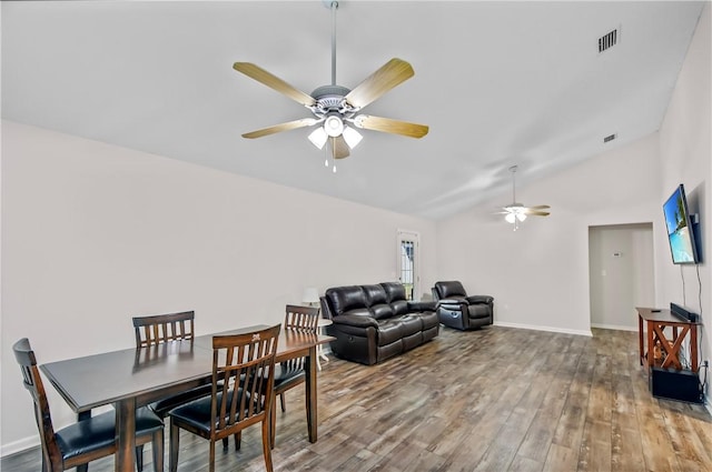 dining space featuring wood-type flooring, ceiling fan, and lofted ceiling