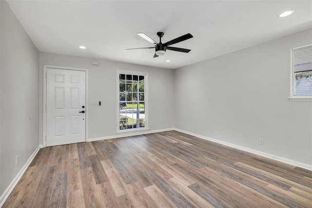 unfurnished room featuring light hardwood / wood-style floors and ceiling fan