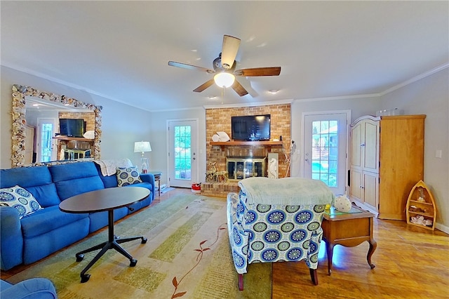 1622 Booth St, Waycross, GA 31501 - living area featuring a fireplace, ornamental molding, wood finished floors, ceiling fan, and baseboards