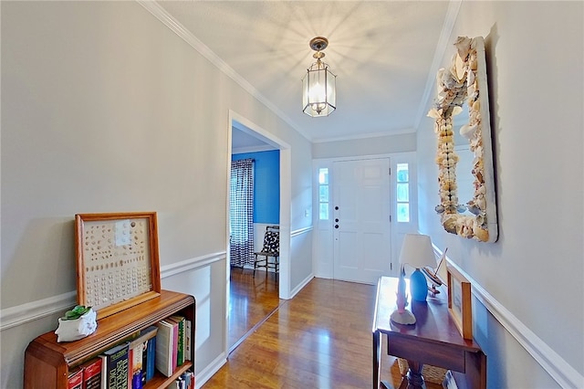 1622 Booth St, Waycross, GA 31501 - foyer with crown molding, a chandelier, and wood finished floors
