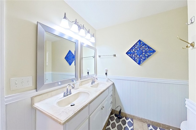 1622 Booth St, Waycross, GA 31501 - full bathroom with a wainscoted wall and double vanity